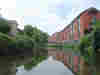 Offices & shops back onto the river as you near the town centre